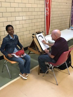 Caricatures on canvas at the Community Health Fair
