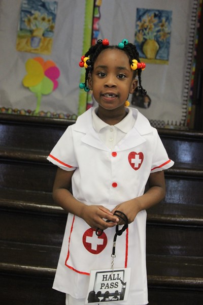 A 1st-grade student dressed for Career Day. She wants to be a nurse when she grows up.